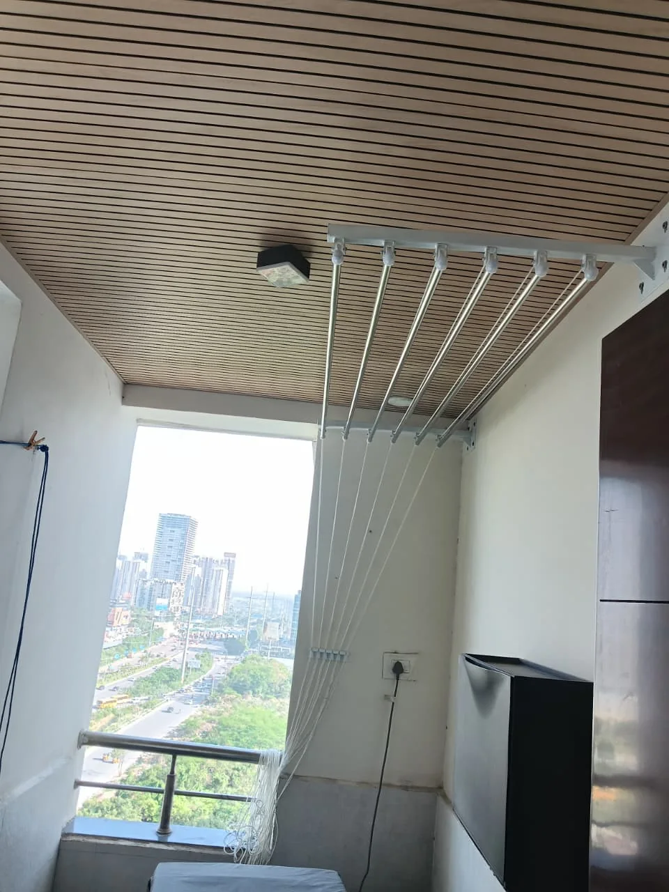 Pulley-operated cloth hanger installed in a home — Foldable Cloth Drying Systems in Manali, Chennai